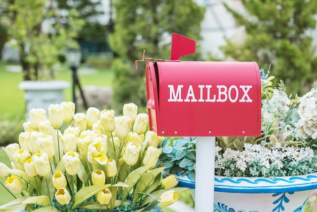 Closeup metal mailbox on garden view textured background