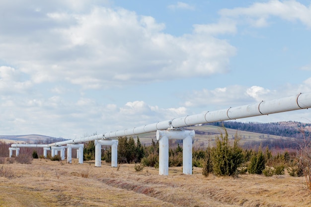 Closeup Metal pipes in the field pipes from the pipeline gas pipeline for gas pumping heatpipe large silver colored pipe for hot water