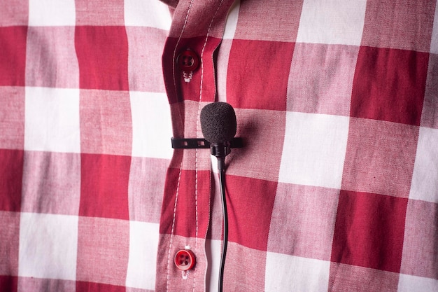 Closeup of a microphone attached to a shirt