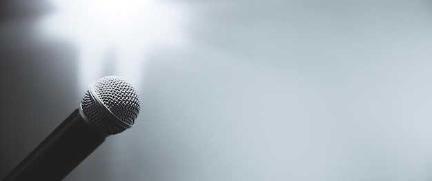 Closeup the microphone on stand with blur background