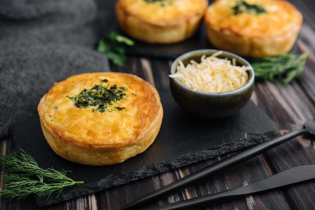 Closeup of mini quiches with dill