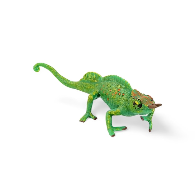 Closeup of a miniature green chameleon animal toy on a white background