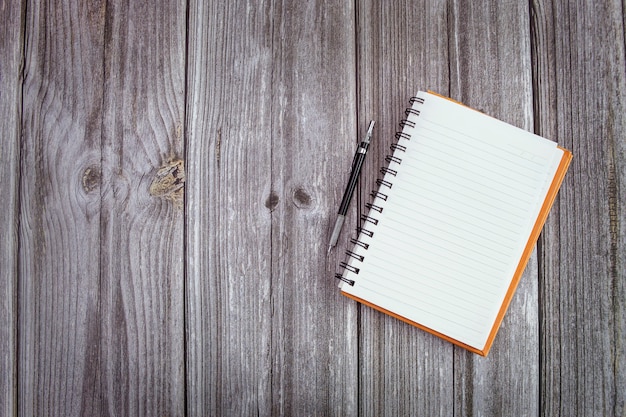 Closeup mockup image of book on wooden table and copy space