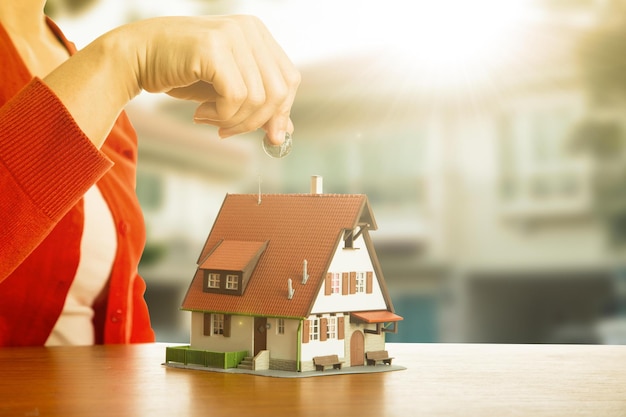 CloseUp Of Model Home On Wooden Table for Real Estate and loan concept