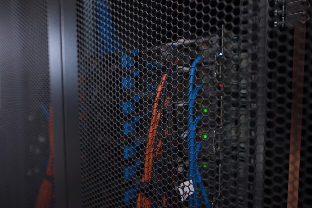 Photo closeup of a modern data center hardware rear side of storage server