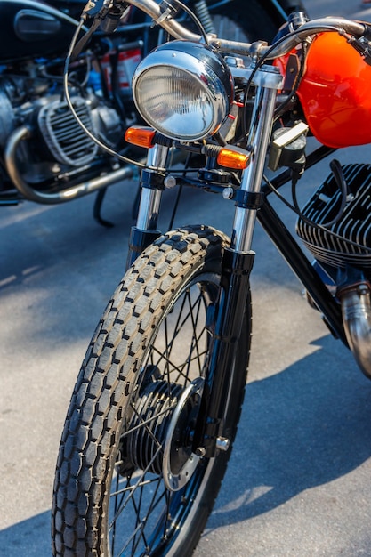 Closeup of motorcycle parked on city street