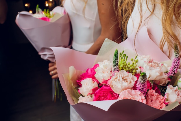 Closeup of a Muted Wedding Bouquet with Pink and Purple Flowers.