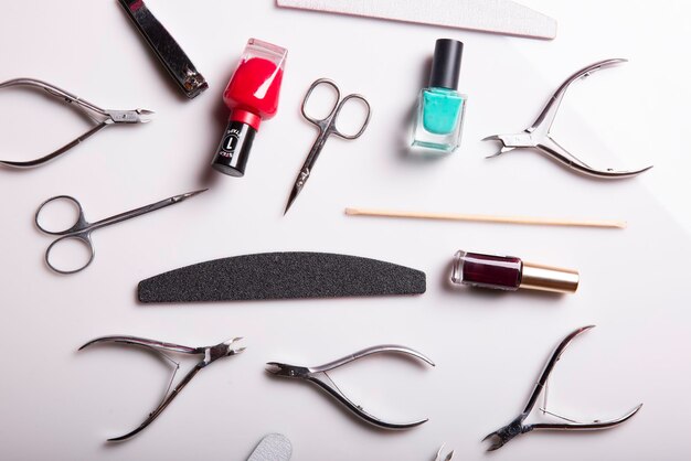 Photo closeup of nail care products on a gray surface