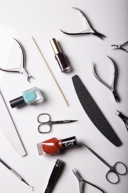 Closeup of nail care products on a gray surface