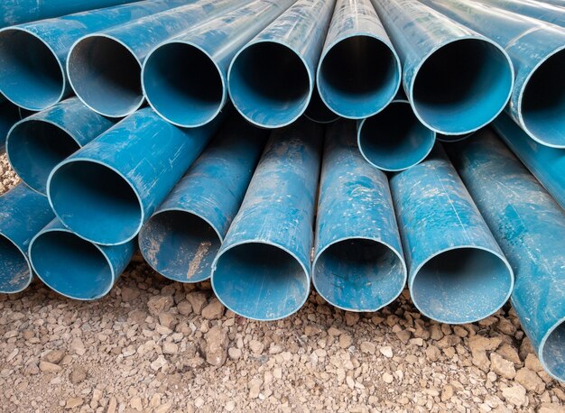 Closeup of the new pvc pipe pile near the construction site for the preparation of the water supply system in rural villages front view with the copy space