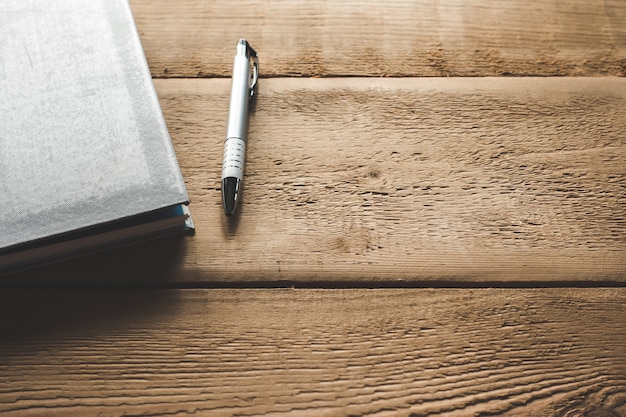 Closeup notebook on wooden table.