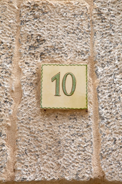 Closeup of Number Ten on Stone Wall