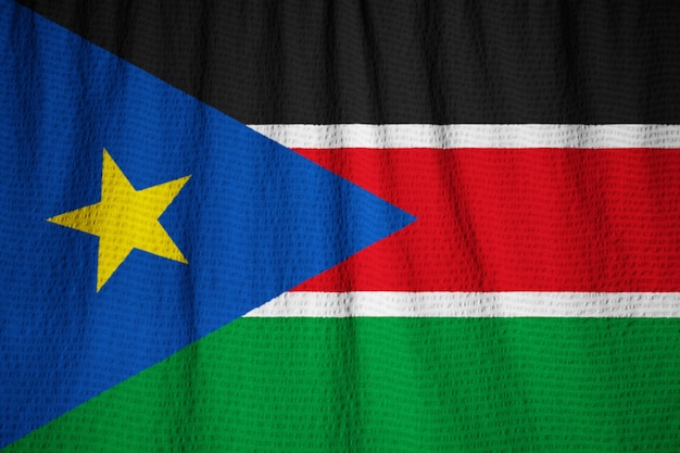 Фото Макрофотография ruffled sudan южный флаг, судан южный флаг, дует в ветре