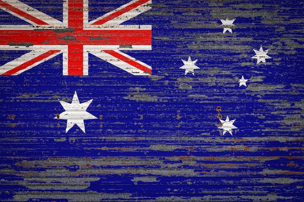 Closeup of old metal wall with national flag of Australia Concept of Australia exportimport storage of goods and national delivery of goods Flag in grunge style