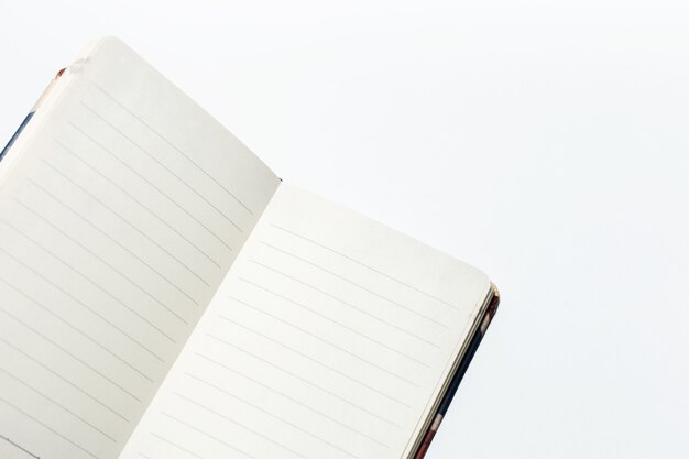 Closeup of opened notebook isolated on white background.