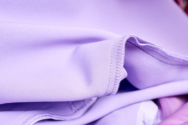 Closeup of Overlock stitch and straight stitch on purple dress