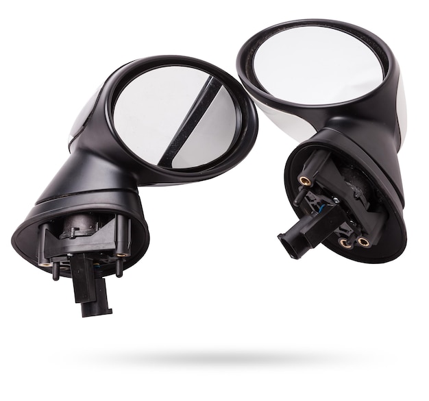 Closeup on a pair of side mirrors from a minibus with turn signal repeaters for repair and replacement after an accident in a workshop Auto service industry Spare parts catalog