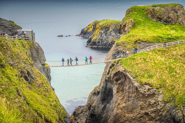 Photo closeup on people on the carrick a rede rope bridge northern ireland