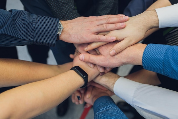 Closeup of people's hands working together team