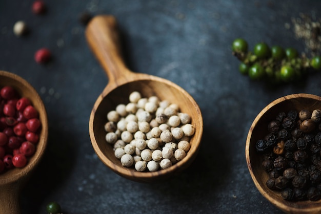 Closeup of peppercorns on black background