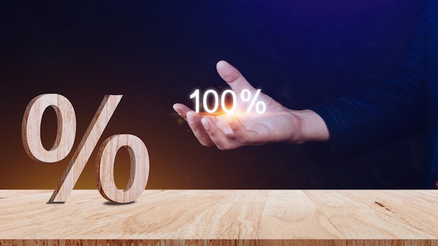 Closeup of percent sign leaning on wooden table Percentage Sign And Discount Rate Accountant VAT Tax Concept