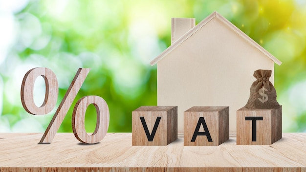 Closeup of percent sign leaning on wooden table Percentage Sign And Discount Rate Accountant VAT Tax Concept