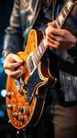 Photo closeup of a person playing the guitar