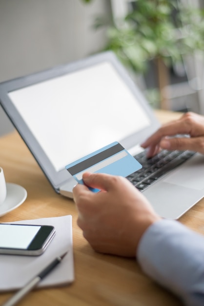 Closeup of Person Using Laptop for Online Shopping