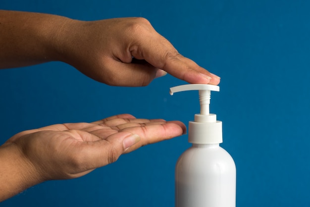 Closeup of person washing hands or using a sanitizing gel.