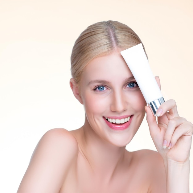 Closeup personable perfect skin woman holding mockup moisturizer product