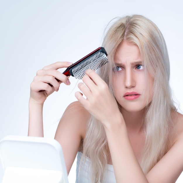 Closeup personable woman with cosmetic skin having dry hair loss problem