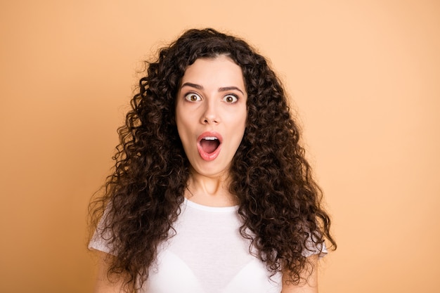 Closeup photo of amazing wavy lady with open mouth listening awful bad news epic fail wear white casual outfit isolated beige pastel color background