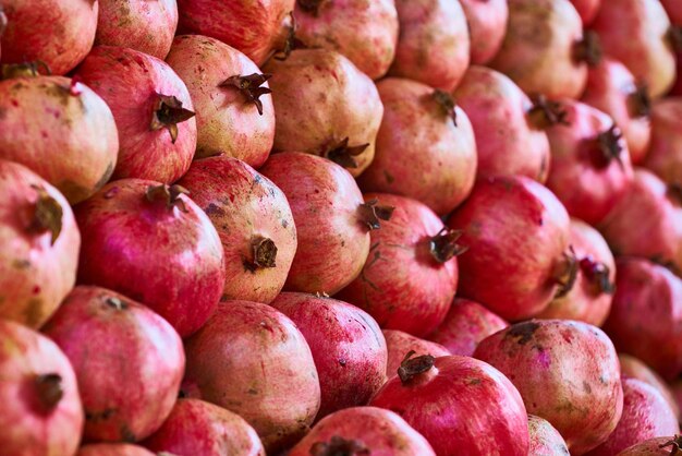 Closeup photo of a bunch of pomegranates photo