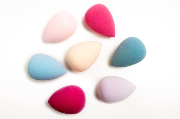 Closeup photo of colorful cosmetic beauty blenders on a white background