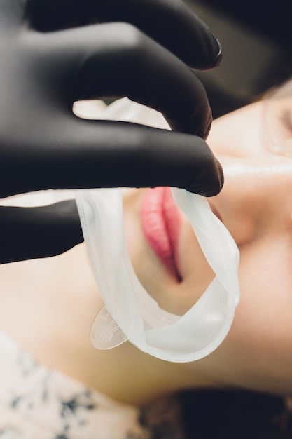 Closeup photo of a disposable dental rubber dam used for keeping soft tissues of mouth safe from den