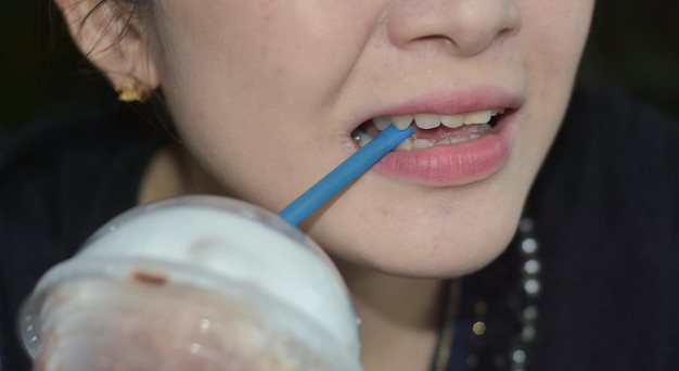 Closeup photo of food in mouth eating food