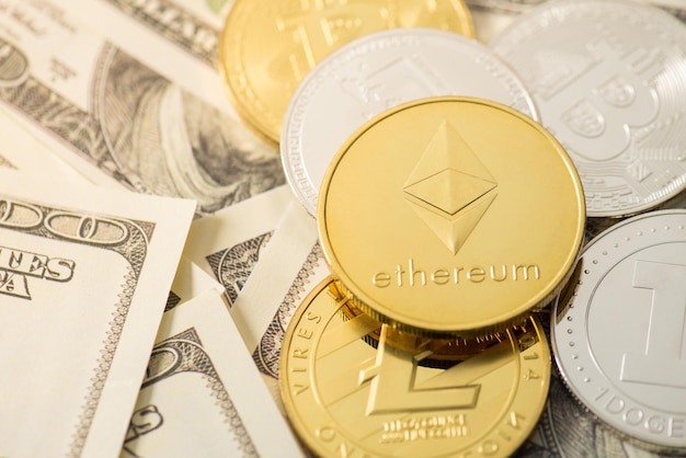 Closeup photo of gold and silver coins with ethereum litecoin dogecoin and bitcoin symbols on hundred dollar bills