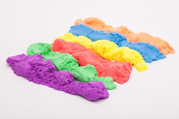 Closeup of a photo of kinetic sand on a white background