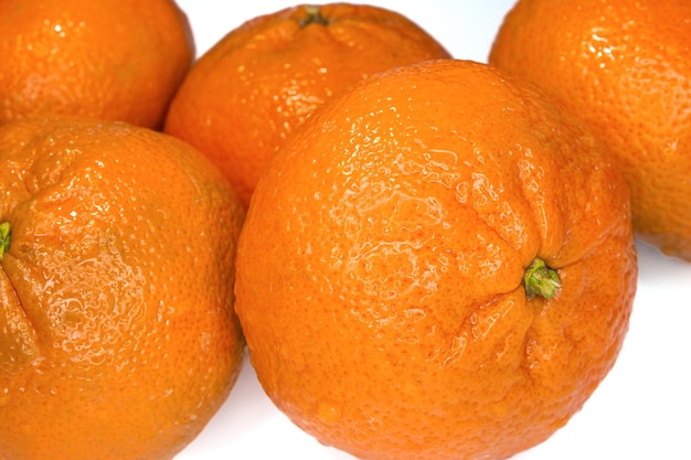 Closeup photo of ripe tangerine or mandarin fruits. Healthy citrus fruit.