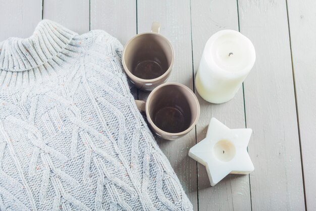 Closeup photo of warm sweater with mug