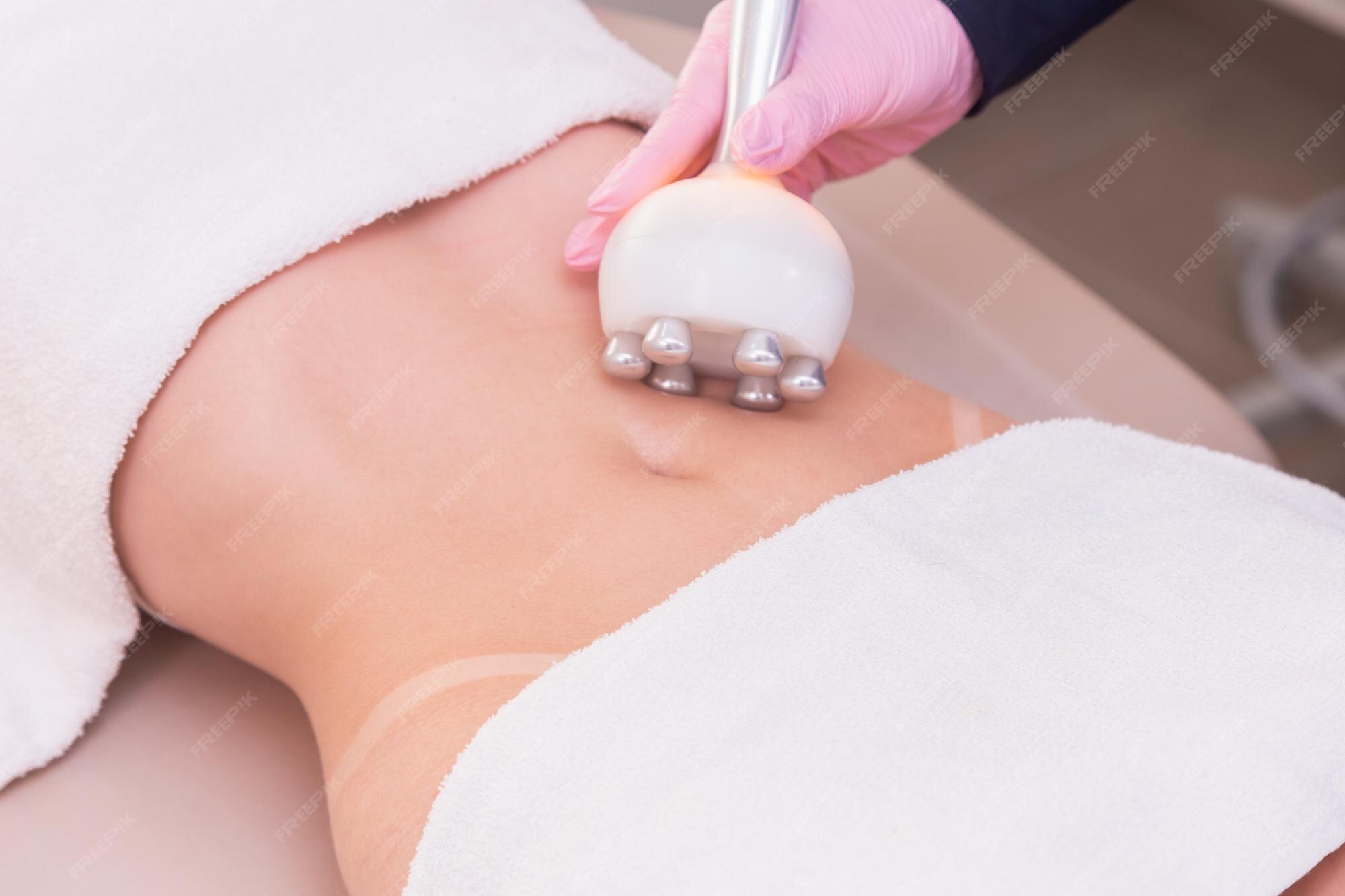 Premium Photo | Closeup photo of a woman's belly photo of aesthetics  procedures on the abdomen beauty clinic radio frequency slimming weight loss