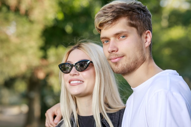 Closeup photo of young couple at the park