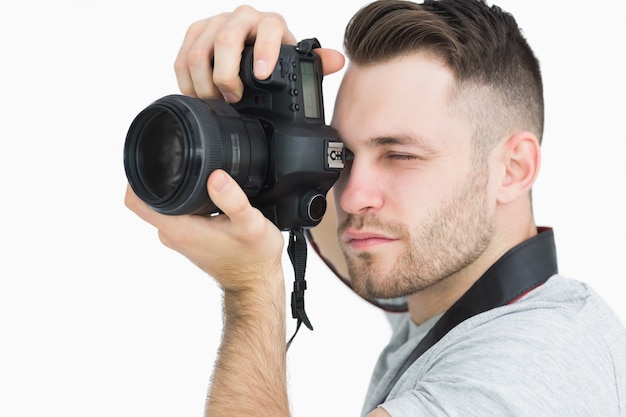 Primo piano del fotografo con macchina fotografica