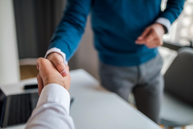 Closeup picture of a handshake between two business partners