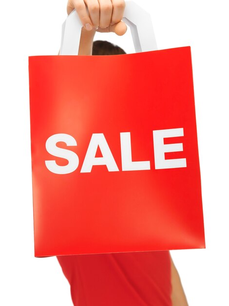 closeup picture of man's hands holding shopping bag