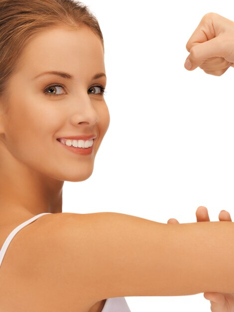 closeup picture of sporty woman flexing her biceps