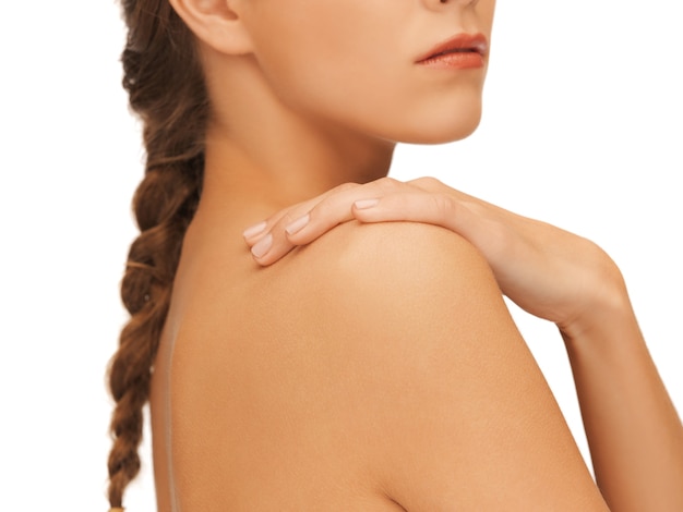 closeup picture of woman's hand and shoulder