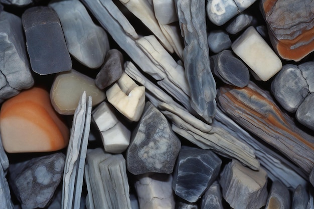 Photo closeup of a pile of pebble stones as a background