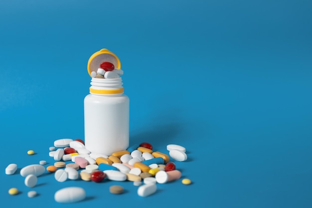 Closeup Pills scattered on the table Many pills of different colors and shapes