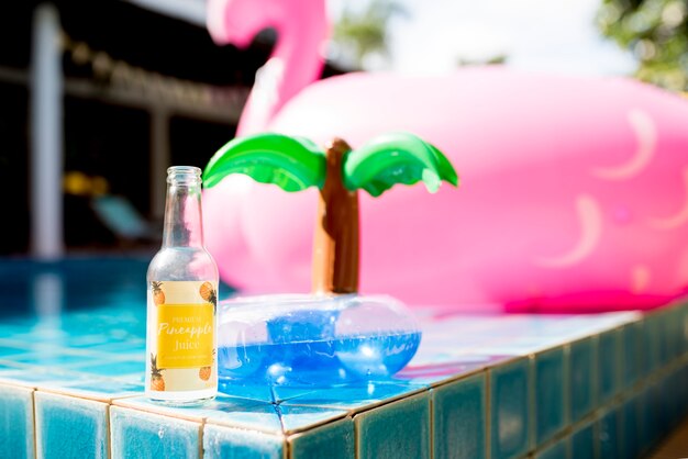 Closeup of pineapple juice bottle with inflatable